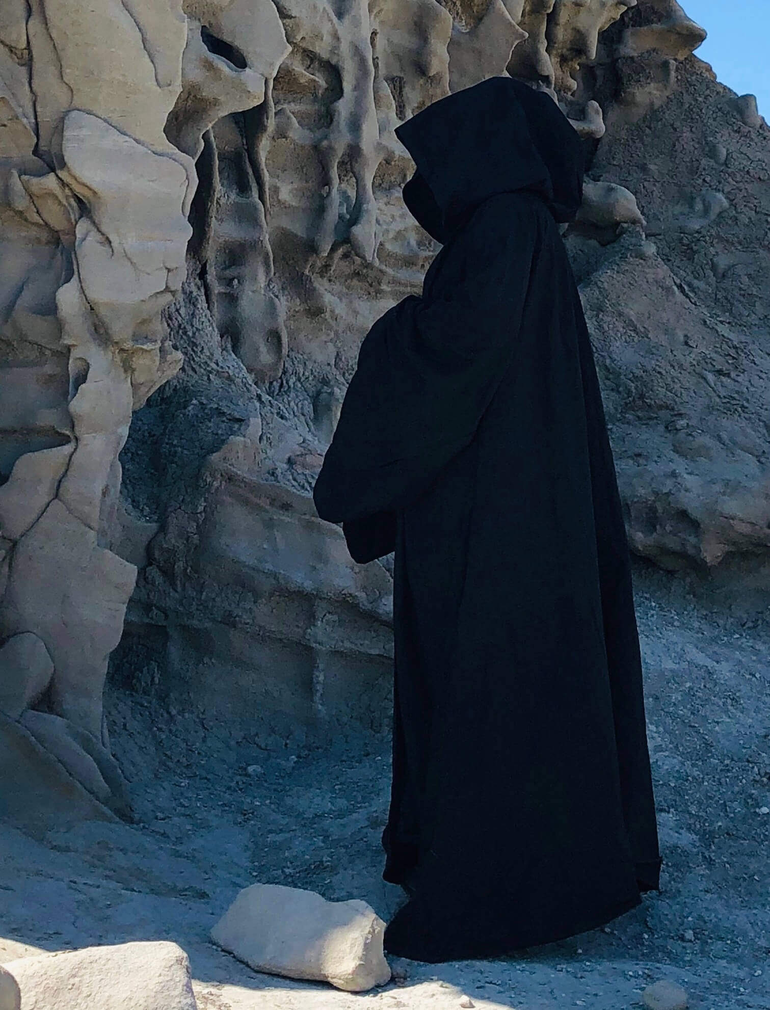 side profile of ghostly figure in full costume robe