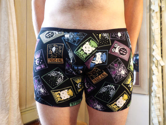 model wearing unique neon tarot boxer briefs