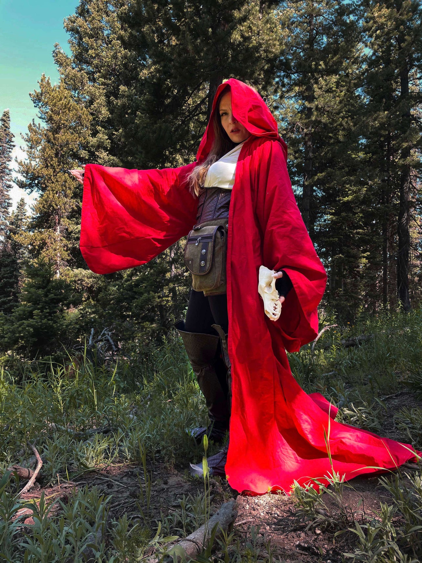 side profile of model in red costume robe