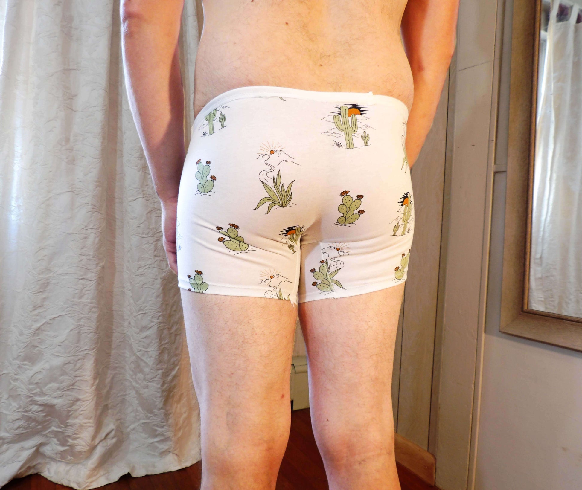 back of man in cactus print boxers