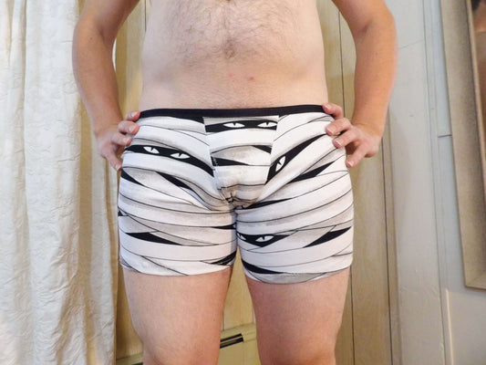 man in boxer briefs with eyes
