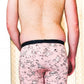 back of model in light pink boxer briefs