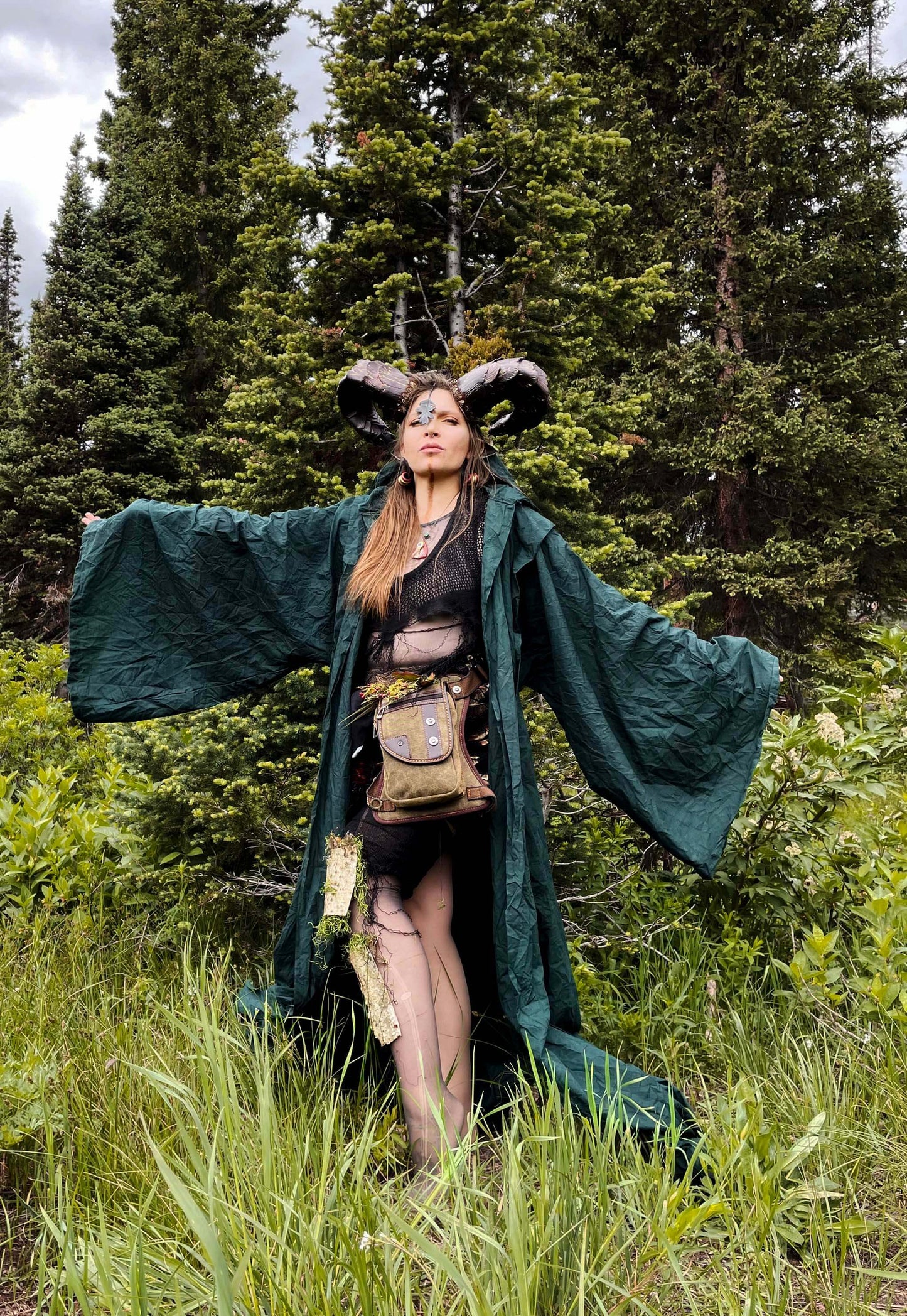 woman in horns and green costume