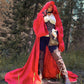 model in red full cloak holding a skull